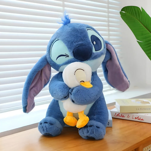 Peluche De Stitch Disney Abrazando Un Patito Tierno Y Suave Stitch Azul